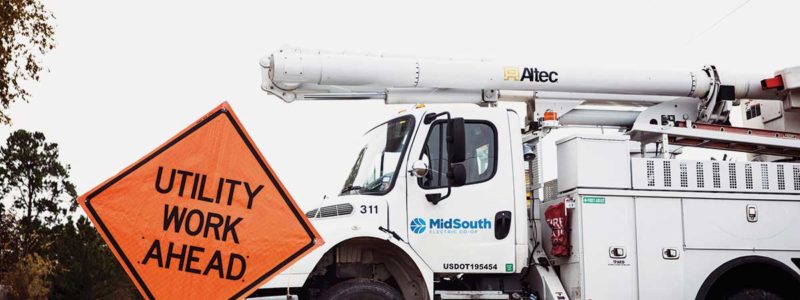 MidSouth EC truck and utility work ahead sign