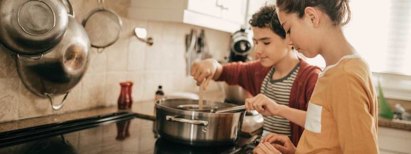 children cook on stovetop