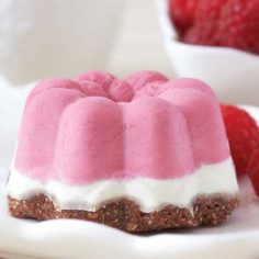 a pink raspberry dessert with an almond crust