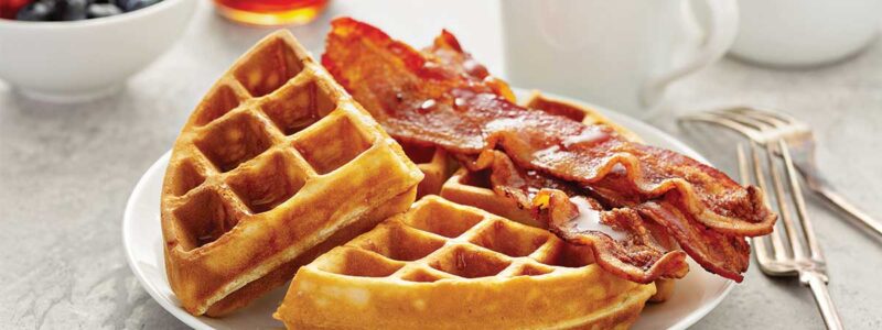 Breakfast plate with waffles and bacon
