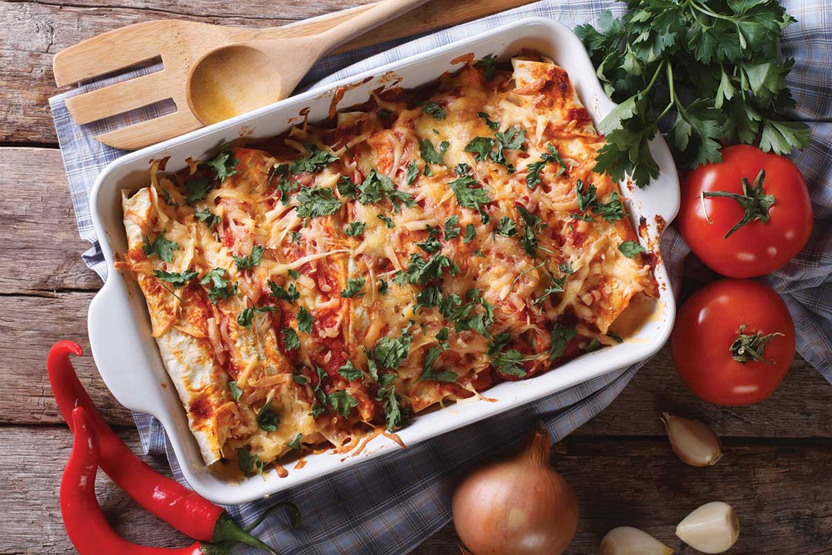 a casserole dish of rustic chicken enchiladas