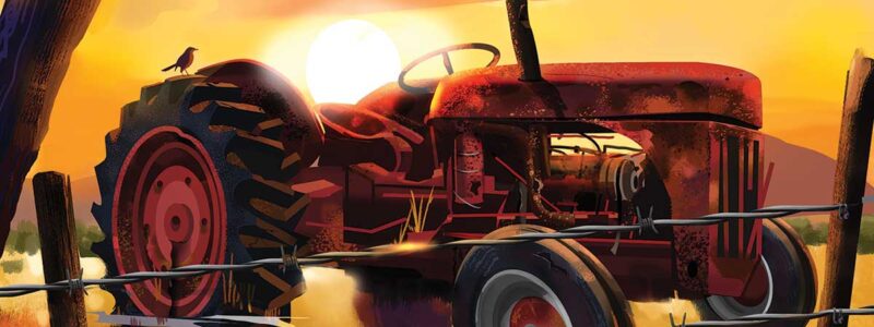 A forlorn, broken-down tractor sinking into the mud at sunset