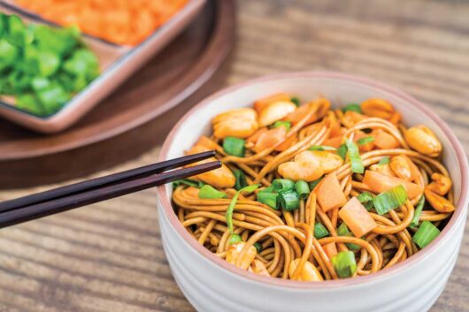 Asian noodle bowl with peanuts and scallions