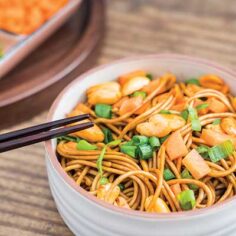 Asian noodle bowl with peanuts and scallions