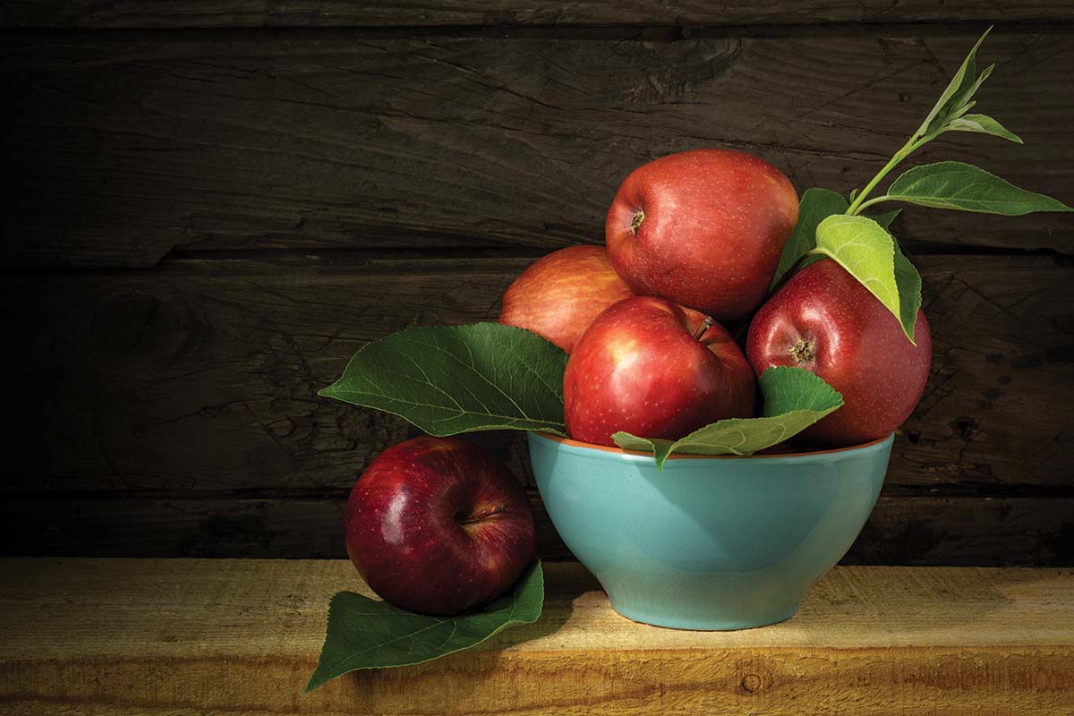 a bowl of apples on a table