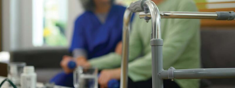 couple talks with walker in the foreground