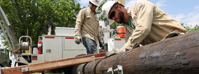 linemen work on a pole